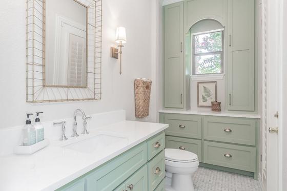 Bathroom remodel with sage green vanity and marble top